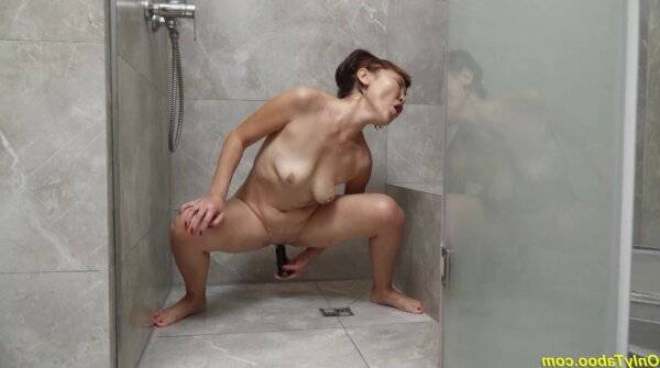 Crazy asian grandma toying at the shower on girlsasian.net