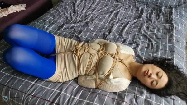 Asian Hogtied In Blue Stockings on girlsasian.net