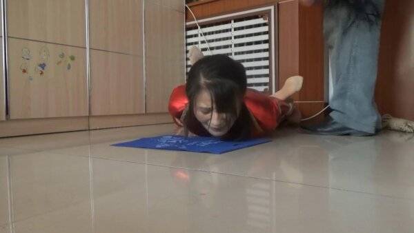 Sluty Asian girl enjoys BDSM and whipping on a floor on girlsasian.net