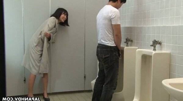 Crazy Asian chick Uta Kohaku pisses on dick of one stranger dude in a public toilet on girlsasian.net