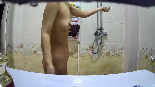 Small breasted asian stepmom spied in shower on girlsasian.net
