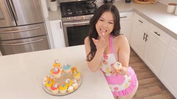 Asian teen has nothing under her apron to seduce a black sweet tooth on girlsasian.net