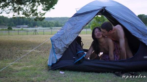 Asian chick is fucking with her boyfriend in a tent outdoors on girlsasian.net