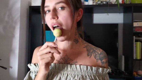 Tattooed brunette gives oral while holding a lollipop in POV shot on girlsasian.net