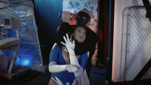 Brunette superheroine in blue mask stripped down under surveillance on girlsasian.net