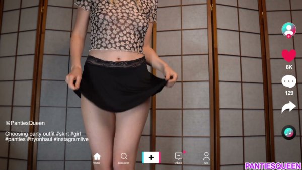 Youthful cam girl teases in lace panties while testing skirts for tonight's stream on girlsasian.net