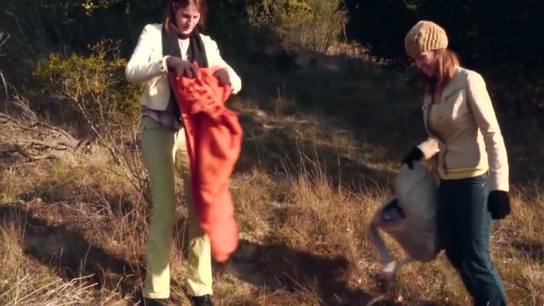 Two women explore each other outdoors with toys and oral passion on girlsasian.net