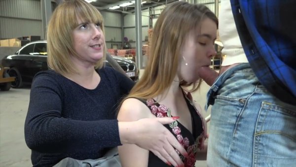 Strict femdom session unfolds in a public warehouse with bondage and deepthroat on girlsasian.net