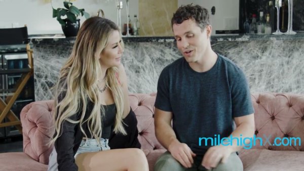 Blonde MILF rides young stud on pink sofa in luxurious modern kitchen on girlsasian.net