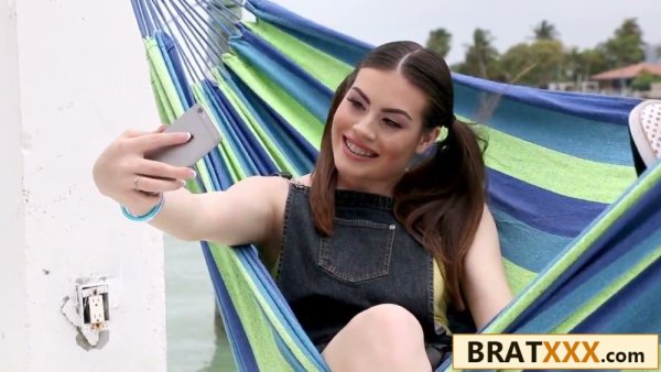 Pigtailed brunette teen with glasses practices on a banana before riding big cock on girlsasian.net