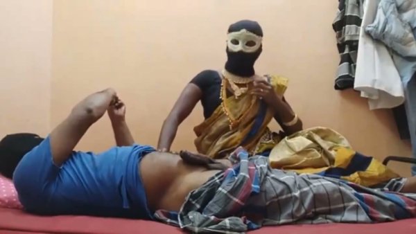 Masked ebony Indian woman teases a sensual ride on her webcam from a red bed - India on girlsasian.net