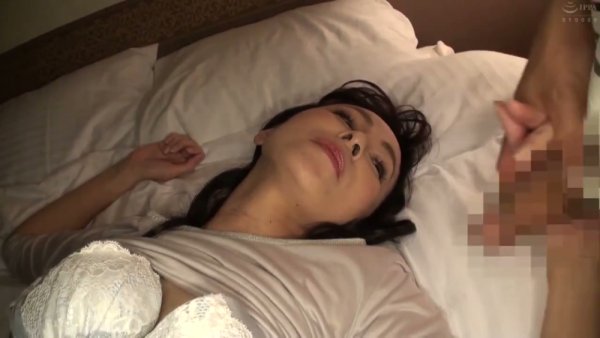 Black-haired Asian woman performs oral sex on her partner in bed - Japan on girlsasian.net
