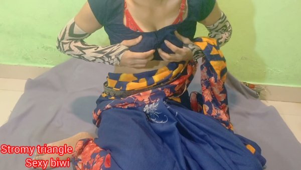 Woman with orange hair spreads her shaved vulva on a gray cloth against a green wall - India on girlsasian.net
